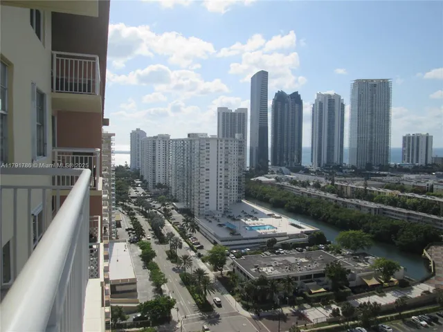 a view of a balcony with a table and chairs