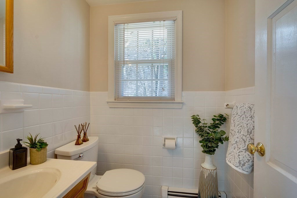 95 Andover Road Billerica, MA 01821 - Photo 12 of 18 a bathroom with a sink a toilet and a window