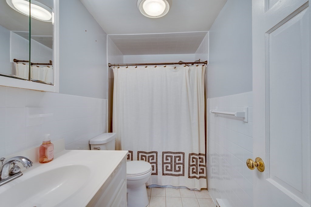 95 Andover Road Billerica, MA 01821 - Photo 13 of 18 a bathroom with a sink toilet and shower