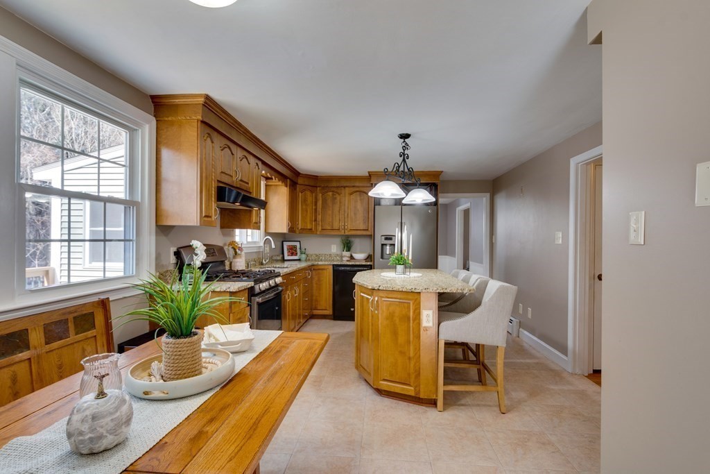 95 Andover Road Billerica, MA 01821 - Photo 4 of 18 a view of a dining room with furniture window and wooden floor