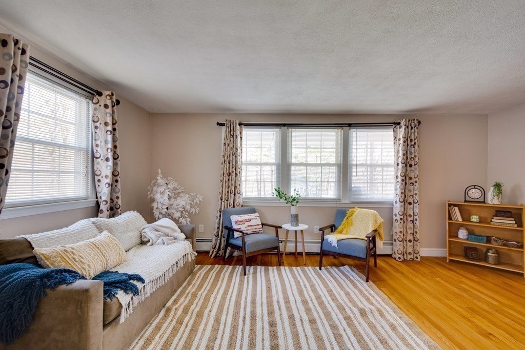 95 Andover Road Billerica, MA 01821 - Photo 8 of 18 a living room with furniture and a wooden floor