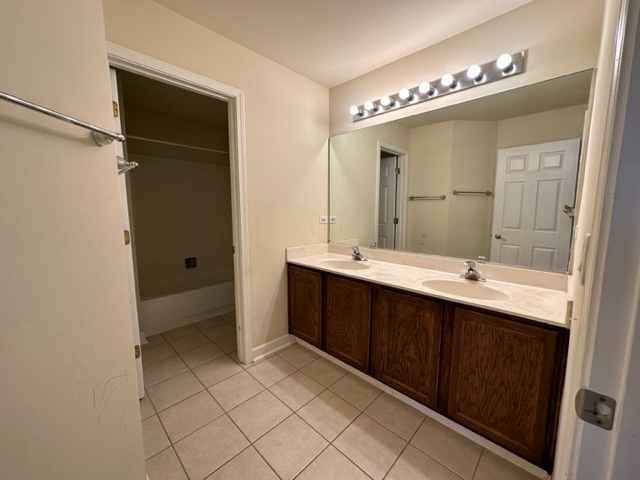 1903 Ridgemoor Drive Plainfield, IL 60586 - Photo 14 of 19 a bathroom with a double vanity sink and mirror