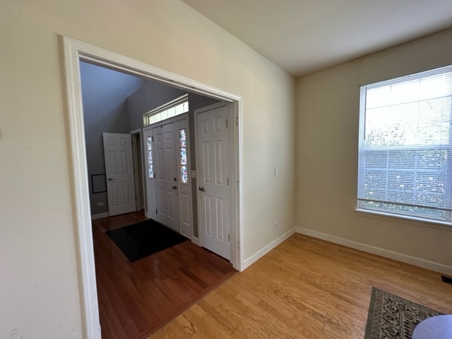 1903 Ridgemoor Drive Plainfield, IL 60586 - Photo 2 of 19 a view of a hallway with wooden floor and a bathroom