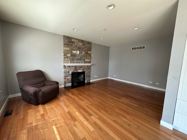 1903 Ridgemoor Drive Plainfield, IL 60586 - Photo 5 of 19 a living room with furniture and a fireplace