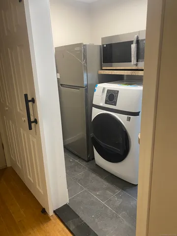 a bathroom with a glass shower door