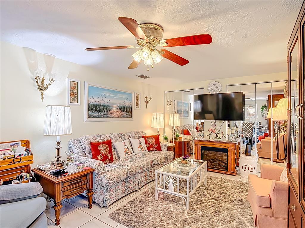 1646 Cockleshell Drive Holiday, FL 34690 - Photo 16 of 36 a living room with furniture and a flat screen tv