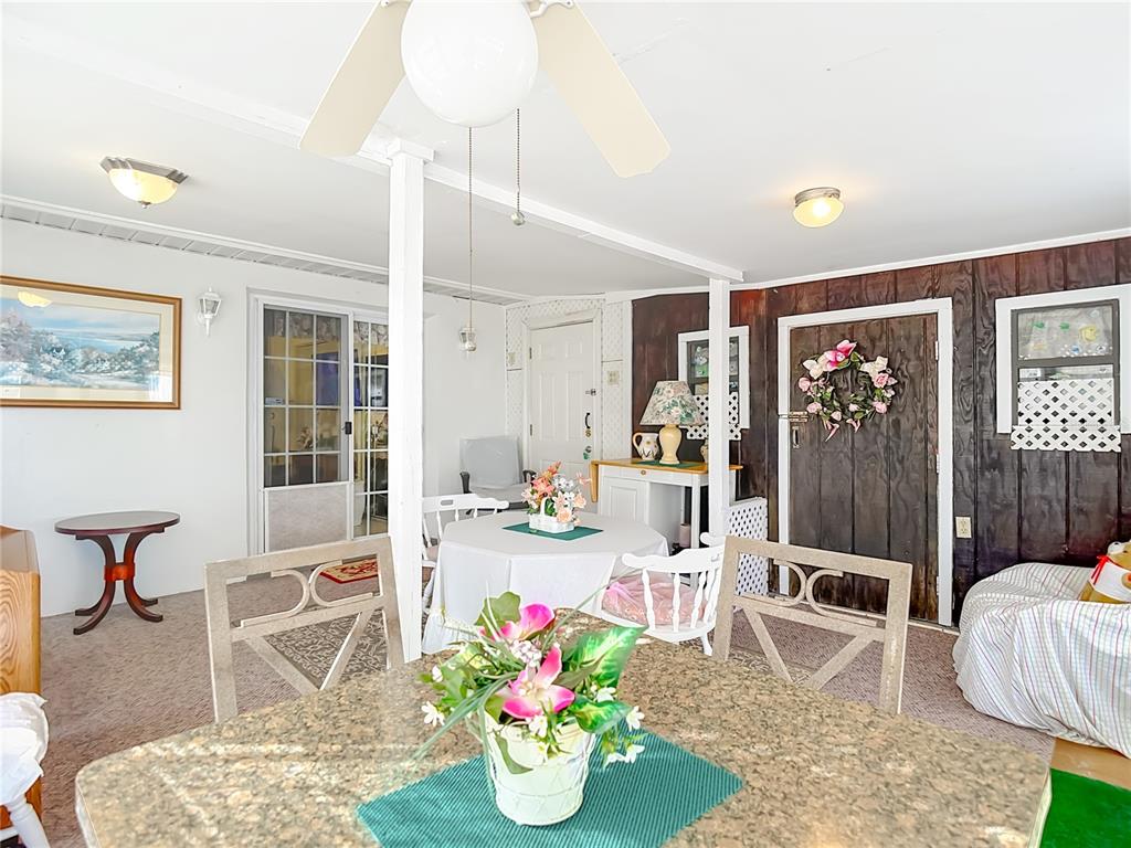 1646 Cockleshell Drive Holiday, FL 34690 - Photo 29 of 36 a living room with furniture and flowers