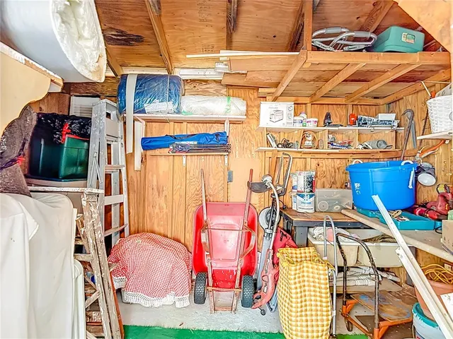 a view of a swimming pool with a table and chairs