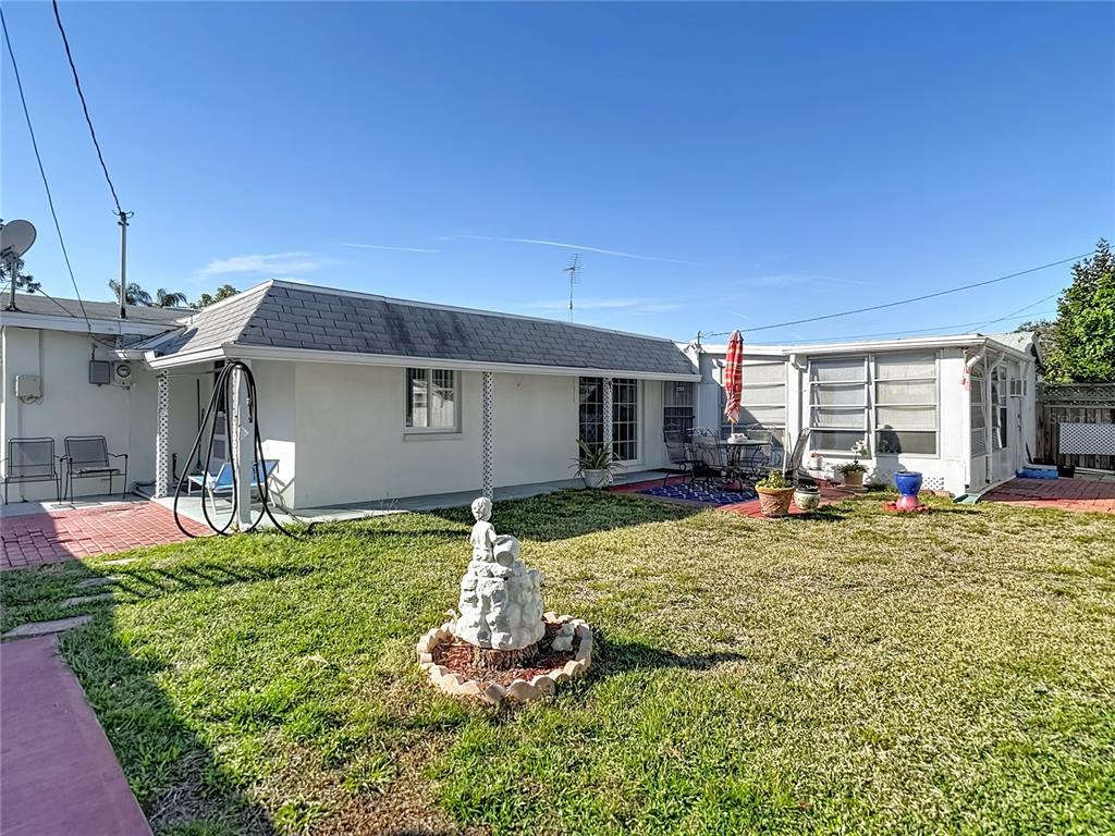 1646 Cockleshell Drive Holiday, FL 34690 - Photo 33 of 36 a front view of house with yard and porch