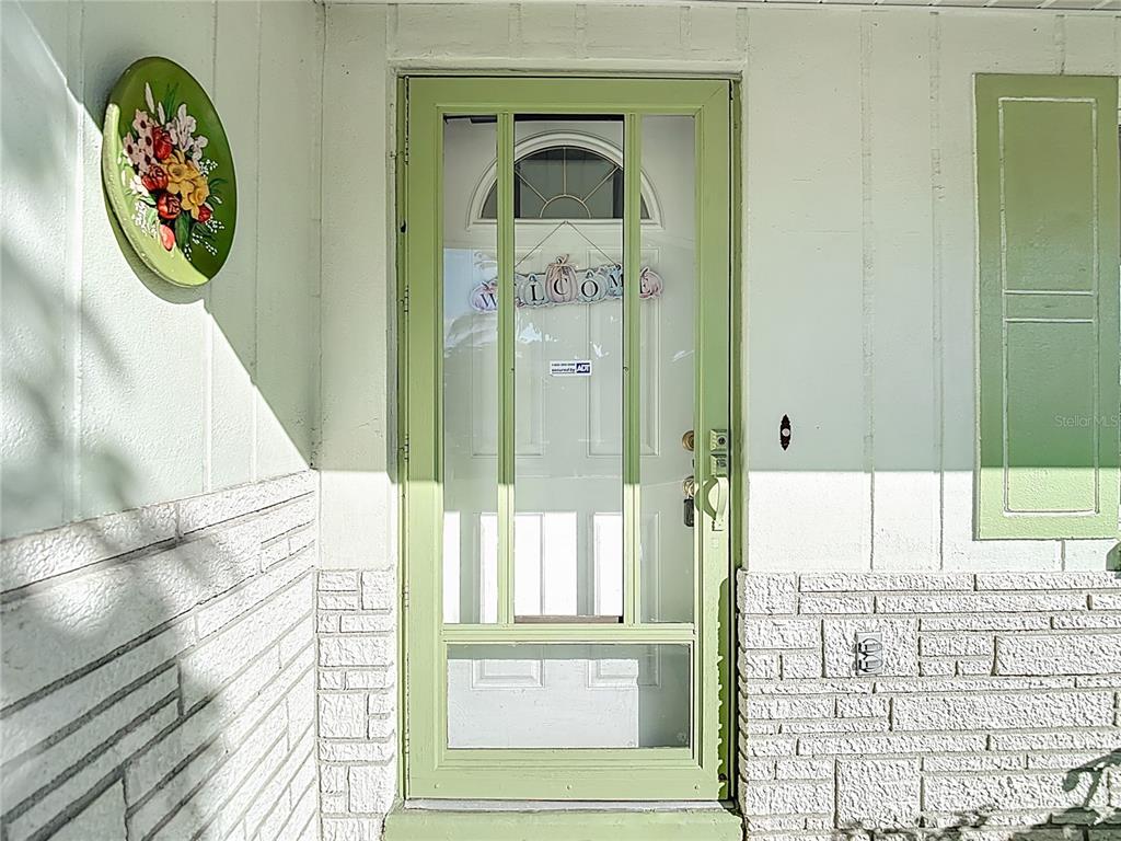 1646 Cockleshell Drive Holiday, FL 34690 - Photo 4 of 36 a view of a entryway door with wooden floor