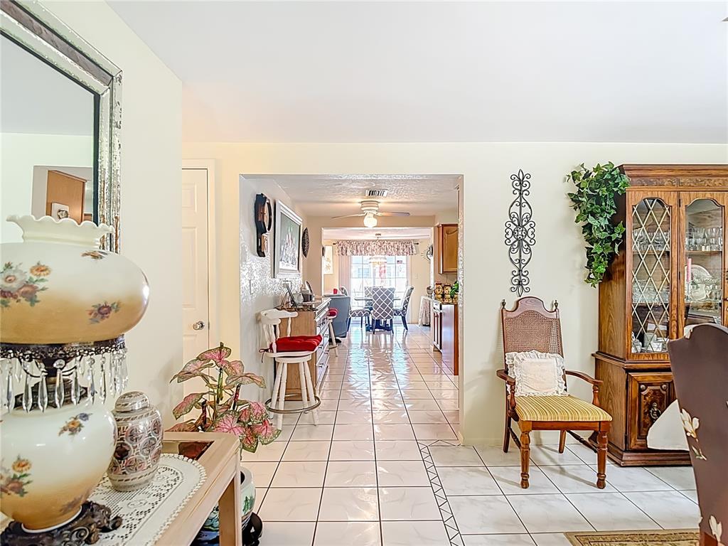 1646 Cockleshell Drive Holiday, FL 34690 - Photo 5 of 36 a living room with furniture and a mirror