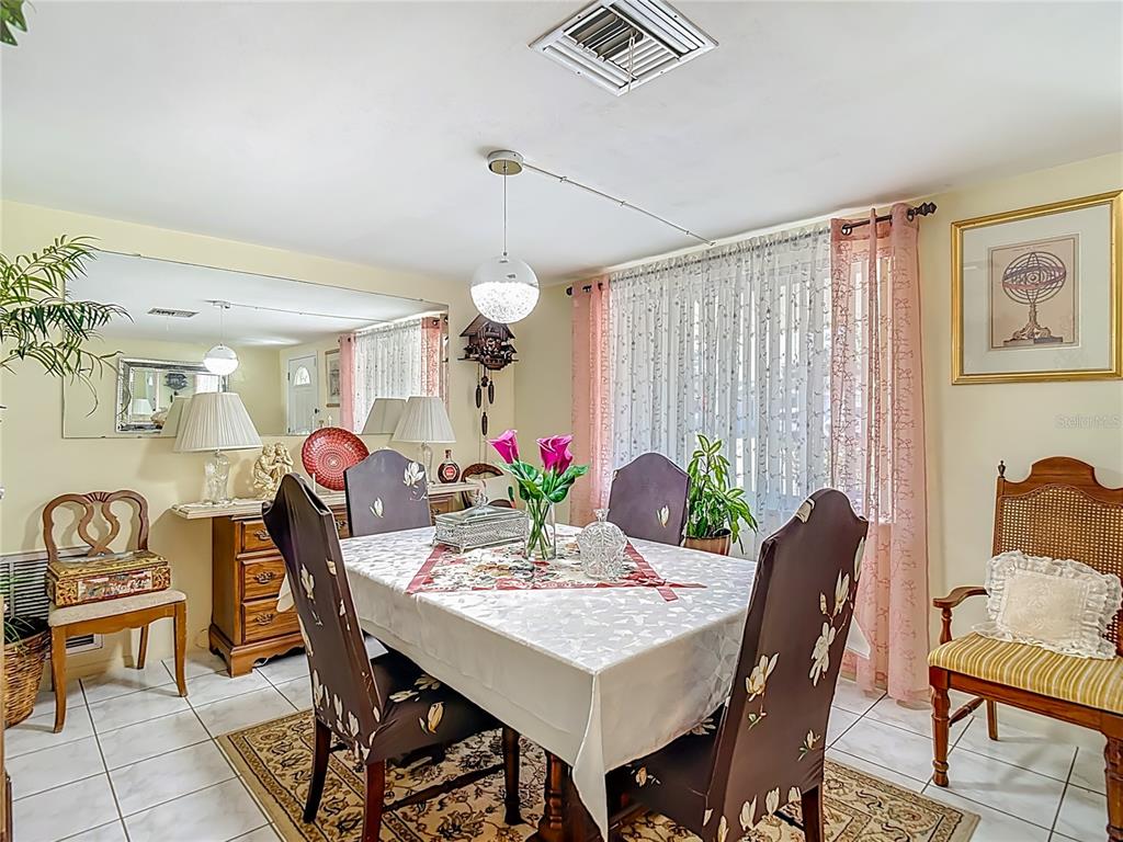 1646 Cockleshell Drive Holiday, FL 34690 - Photo 8 of 36 a view of a dining room with furniture and window