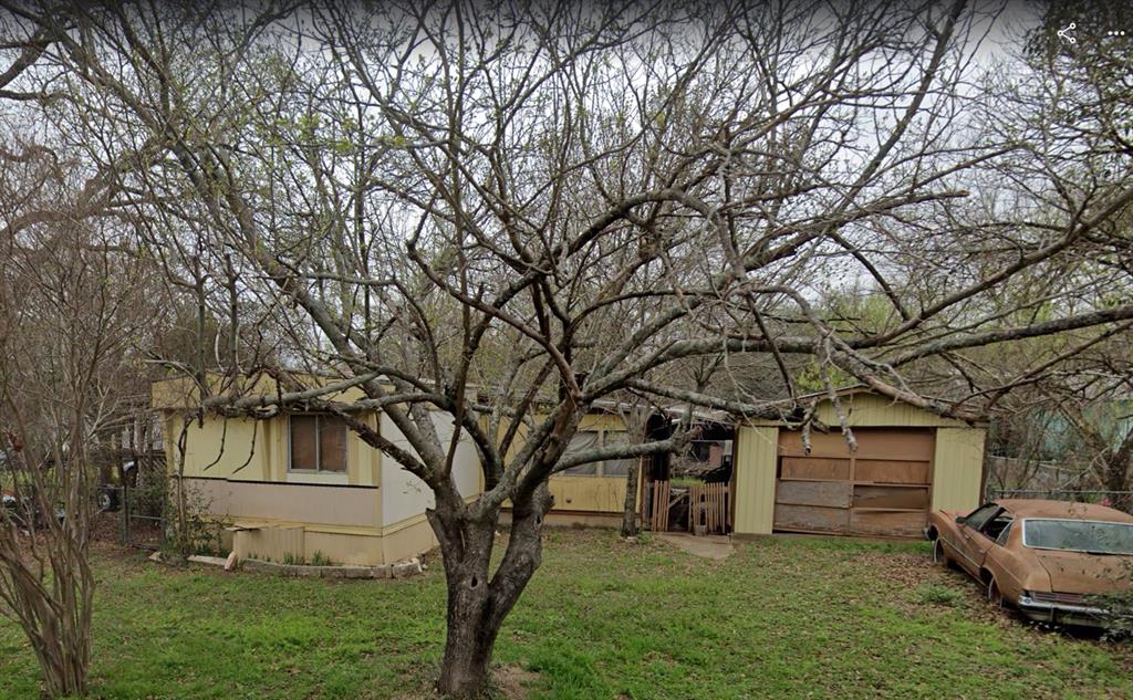 114 County Road 1423 Morgan, TX 76671 - Photo 7 of 10 a view of a house with a yard