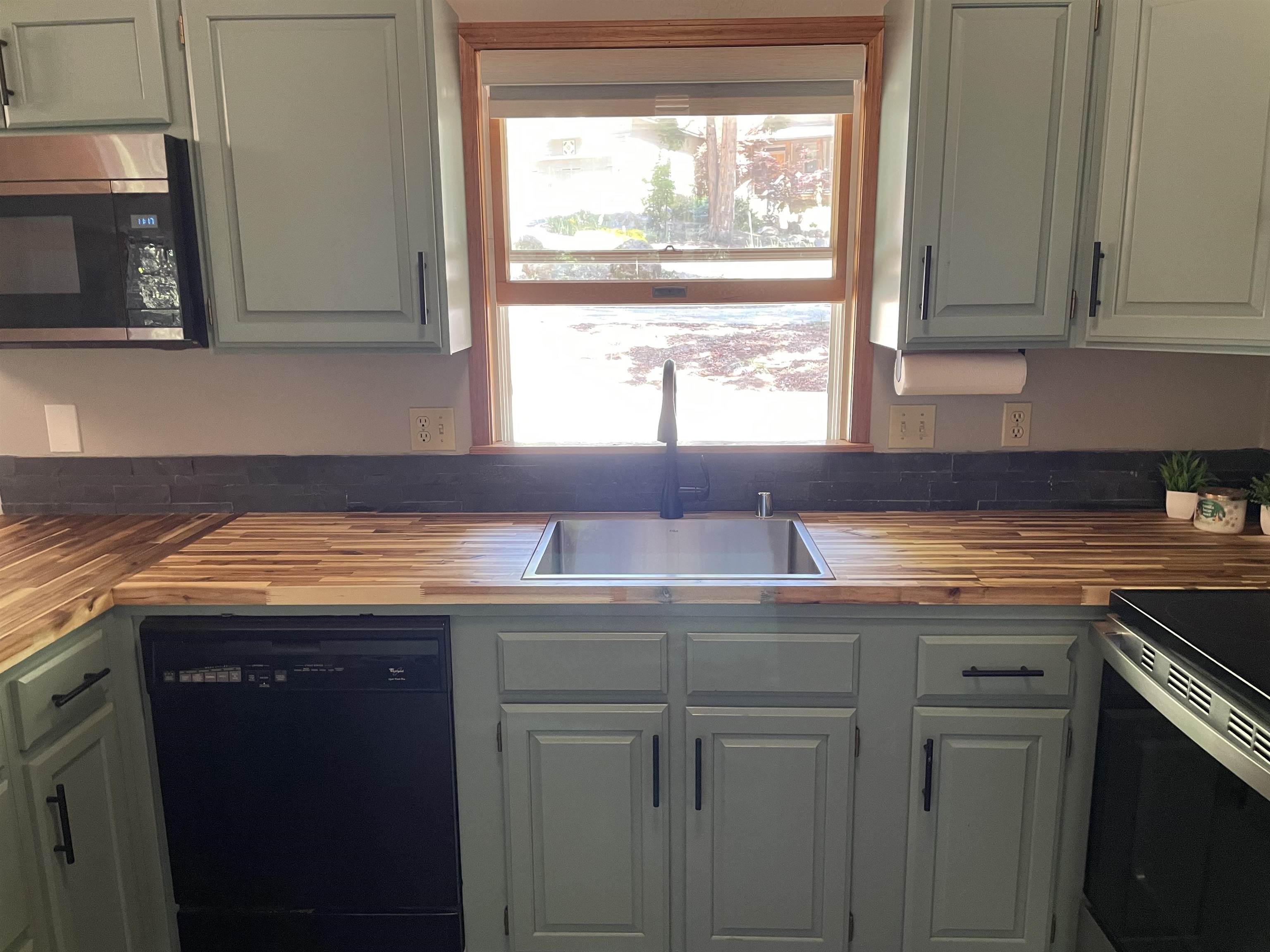 603 East Burnt Cedar Road Lake Almanor, CA 96137 - Photo 13 of 33 a kitchen with granite countertop a sink and a stove