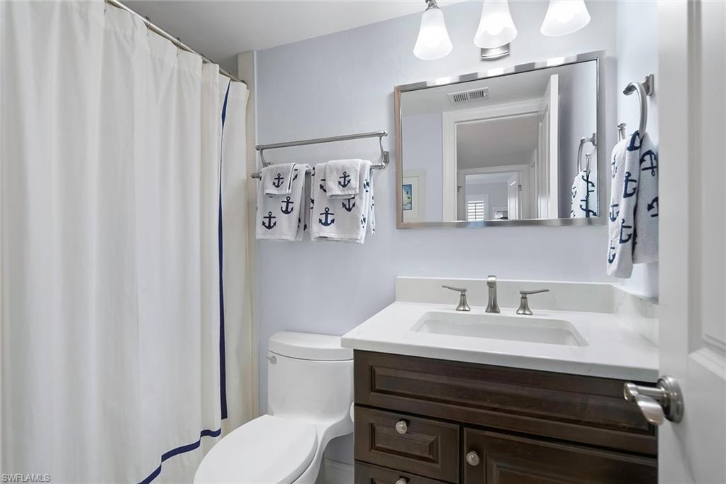 4160 Crayton Road, Unit A5 Naples, FL 34103 - Photo 16 of 46 Guest bath offers a versatile combo tub and shower