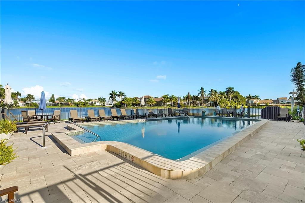 4160 Crayton Road, Unit A5 Naples, FL 34103 - Photo 17 of 46 Enjoy refreshing breezes by the lakefront community pool