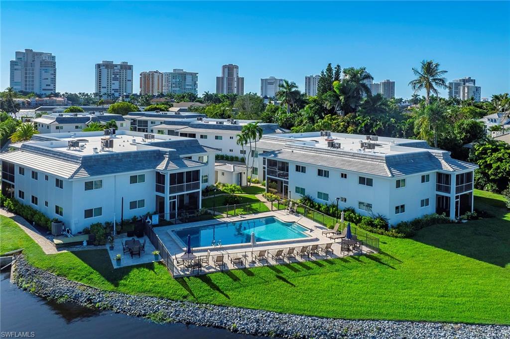 4160 Crayton Road, Unit A5 Naples, FL 34103 - Photo 24 of 46 Recently updated with new roofs, exterior paint, and lush landscaping