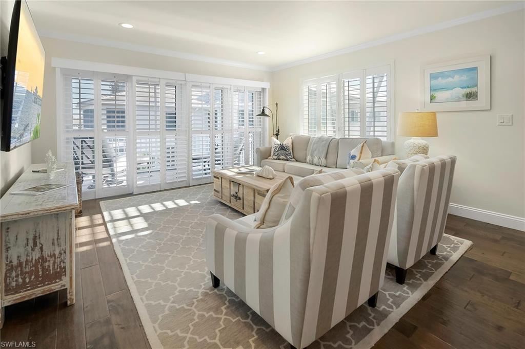 4160 Crayton Road, Unit A5 Naples, FL 34103 - Photo 25 of 46 Living room filled with abundant natural light