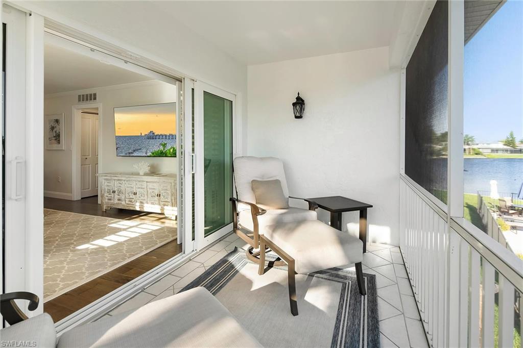 4160 Crayton Road, Unit A5 Naples, FL 34103 - Photo 26 of 46 Your private lanai retreat, perfect for relaxing in style
