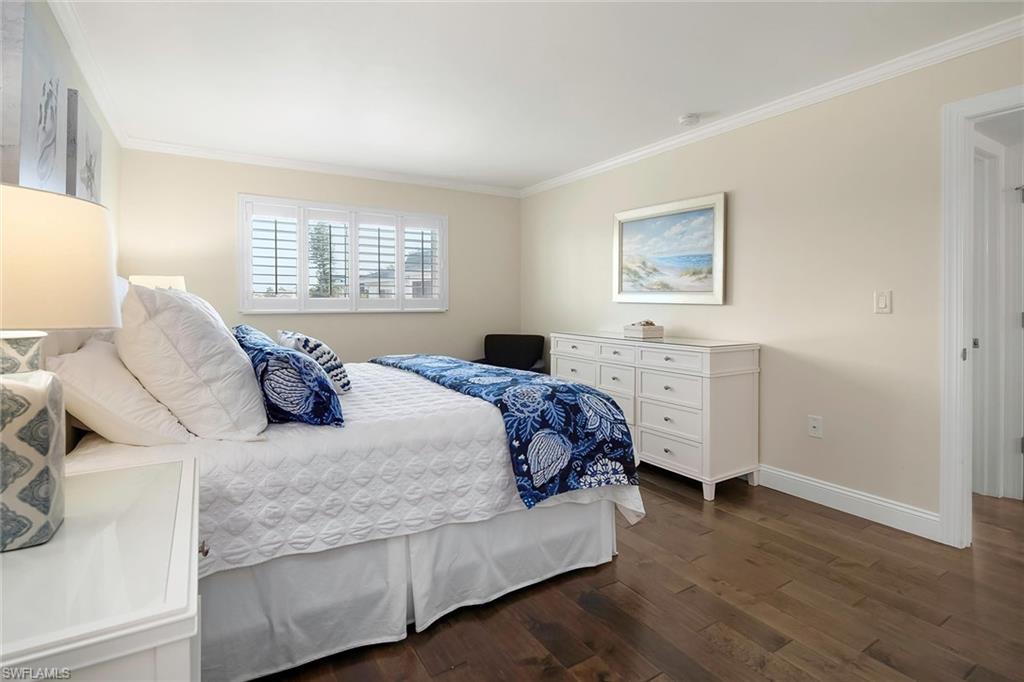 4160 Crayton Road, Unit A5 Naples, FL 34103 - Photo 27 of 46 King primary suite overlooking the serene lake