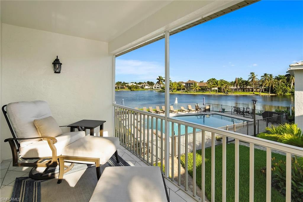 4160 Crayton Road, Unit A5 Naples, FL 34103 - Photo 3 of 46 Screened lanai overlooking the tranquil lake