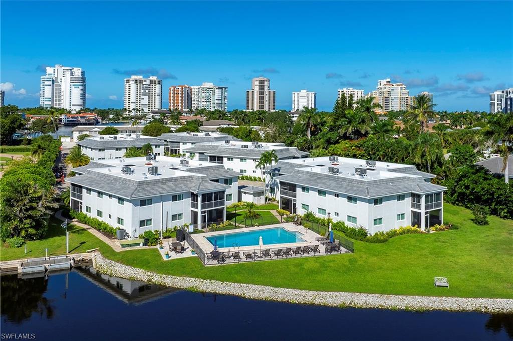 4160 Crayton Road, Unit A5 Naples, FL 34103 - Photo 33 of 46 Relax by the breezy lakefront pool