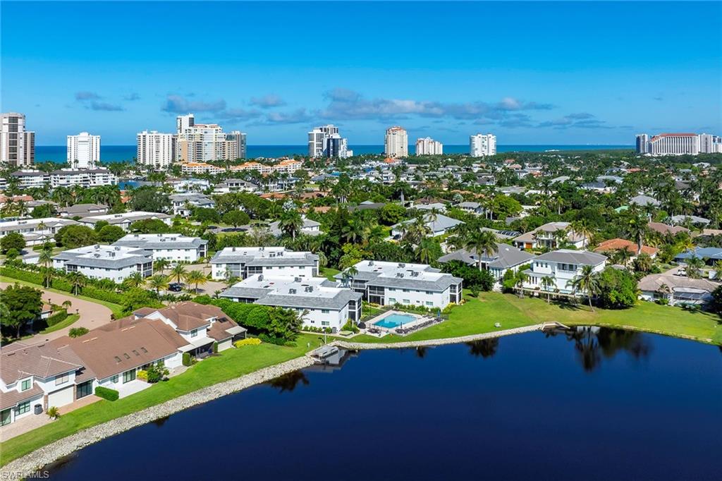 4160 Crayton Road, Unit A5 Naples, FL 34103 - Photo 35 of 46 Pool overlooks a large, tranquil lake