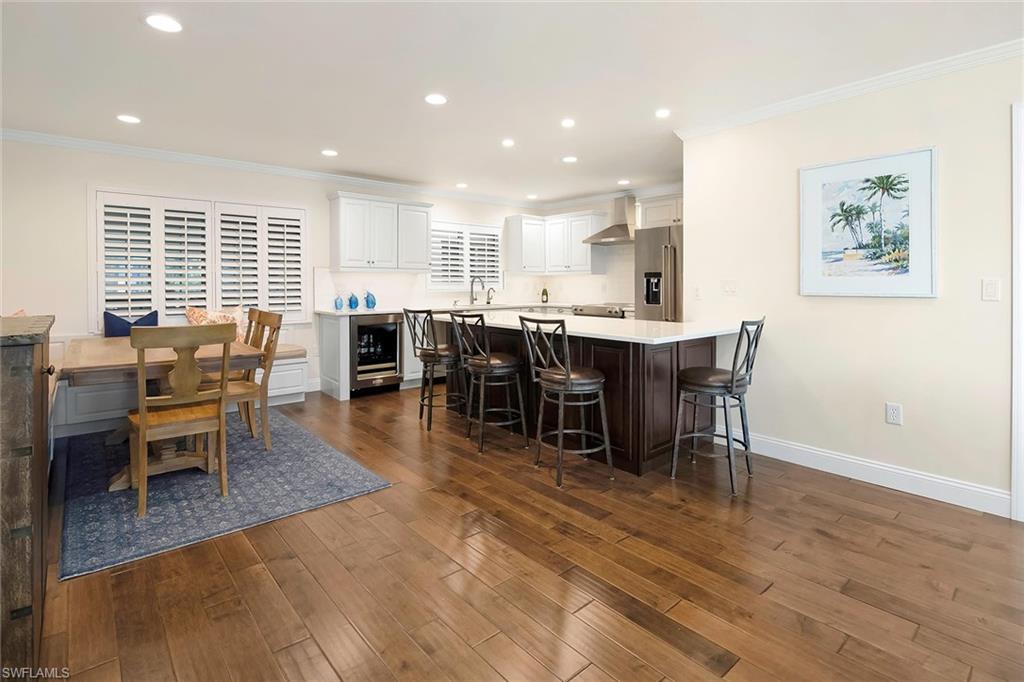 4160 Crayton Road, Unit A5 Naples, FL 34103 - Photo 6 of 46 Elegant wood plank flooring throughout