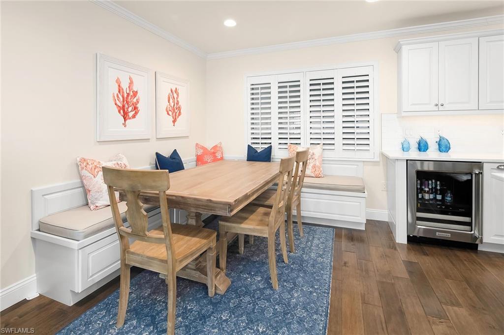 4160 Crayton Road, Unit A5 Naples, FL 34103 - Photo 7 of 46 Cozy dining space with wine fridge nearby
