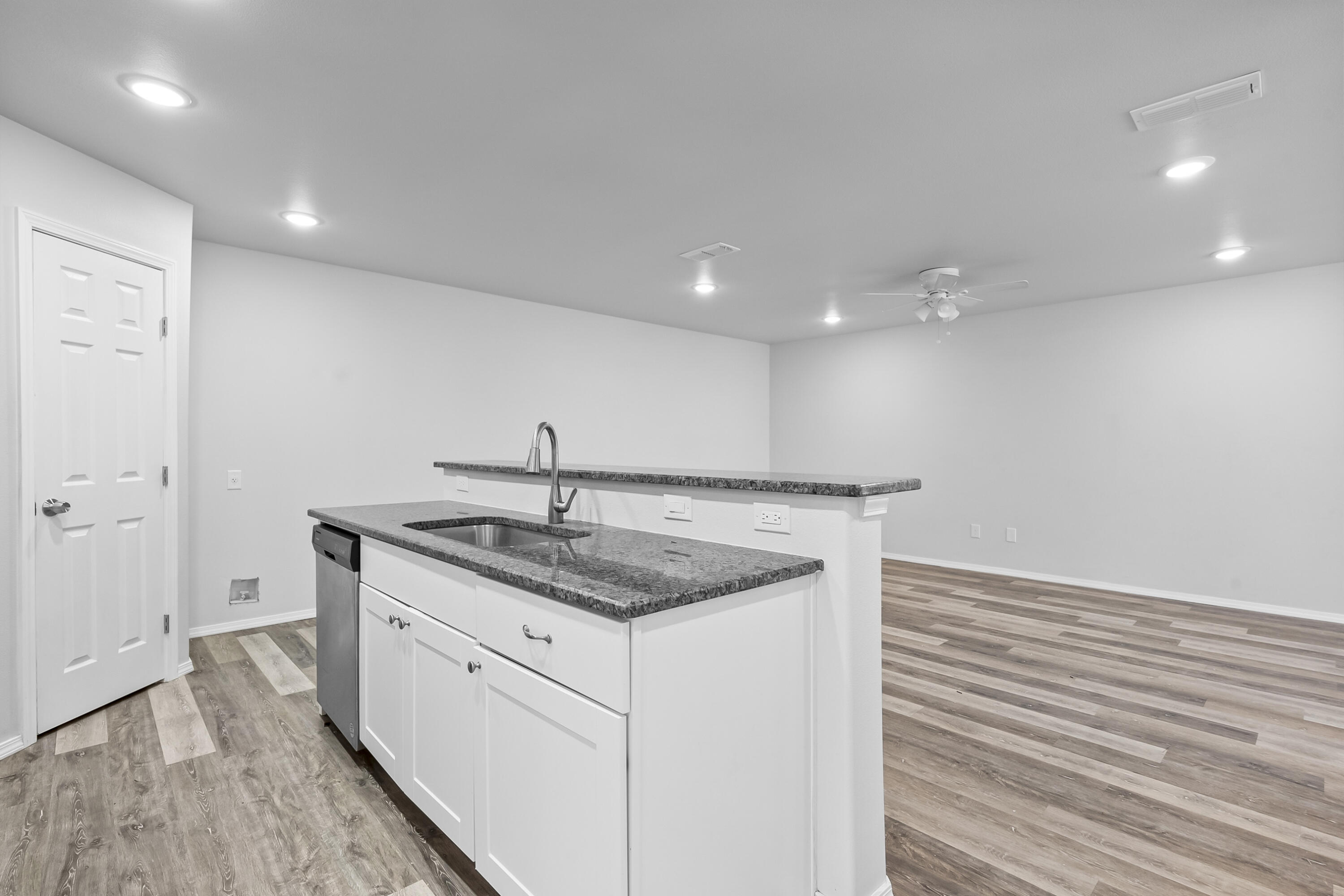 5609 Jarvis Street, Unit B Lubbock, TX 79416 - Photo 13 of 24 a kitchen with a sink and cabinets