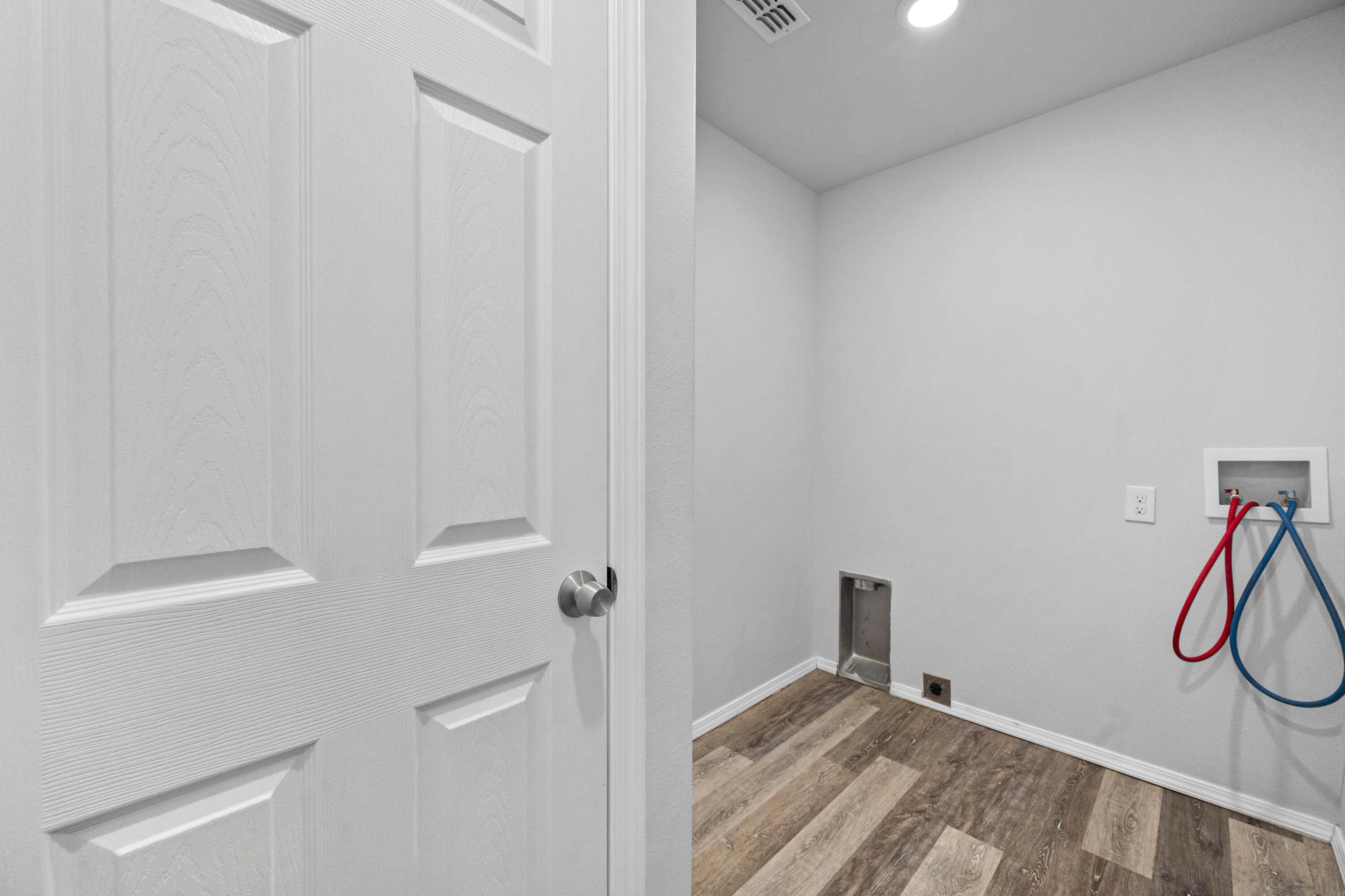 5609 Jarvis Street, Unit B Lubbock, TX 79416 - Photo 17 of 24 a view of a room with rack on the wall