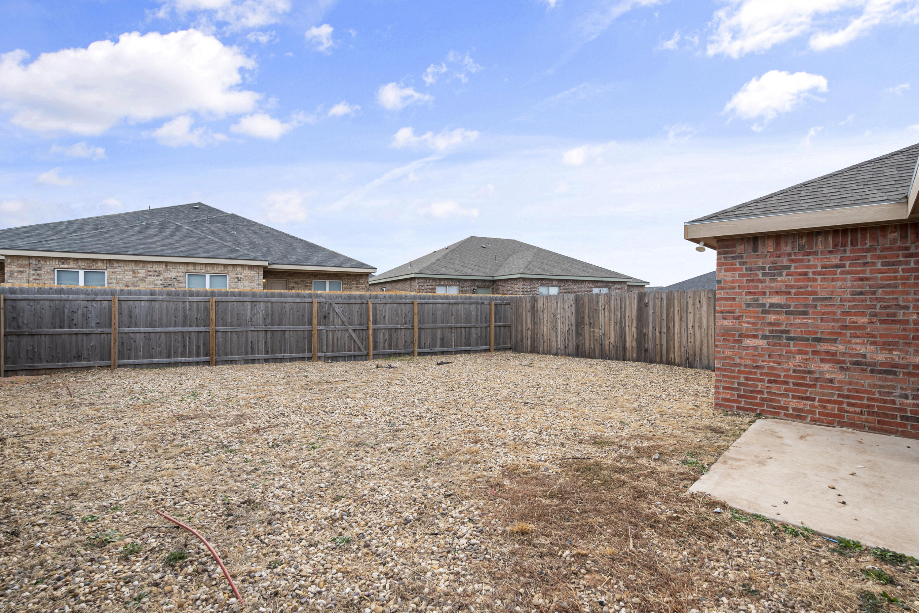 5609 Jarvis Street, Unit B Lubbock, TX 79416 - Photo 22 of 24 a view of a backyard with wooden fence