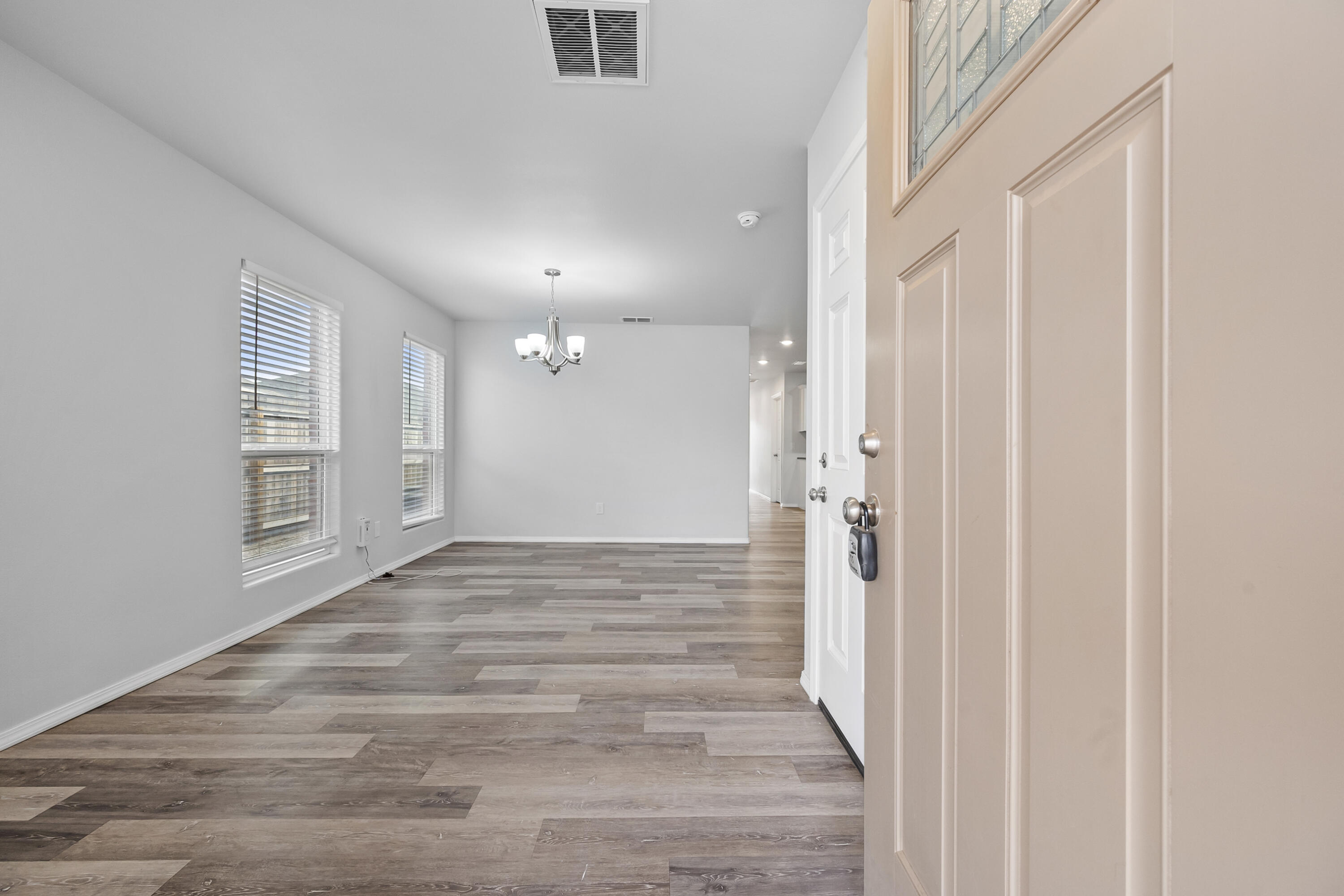 5609 Jarvis Street, Unit B Lubbock, TX 79416 - Photo 24 of 24 a view of a hallway with wooden floor and a bathroom