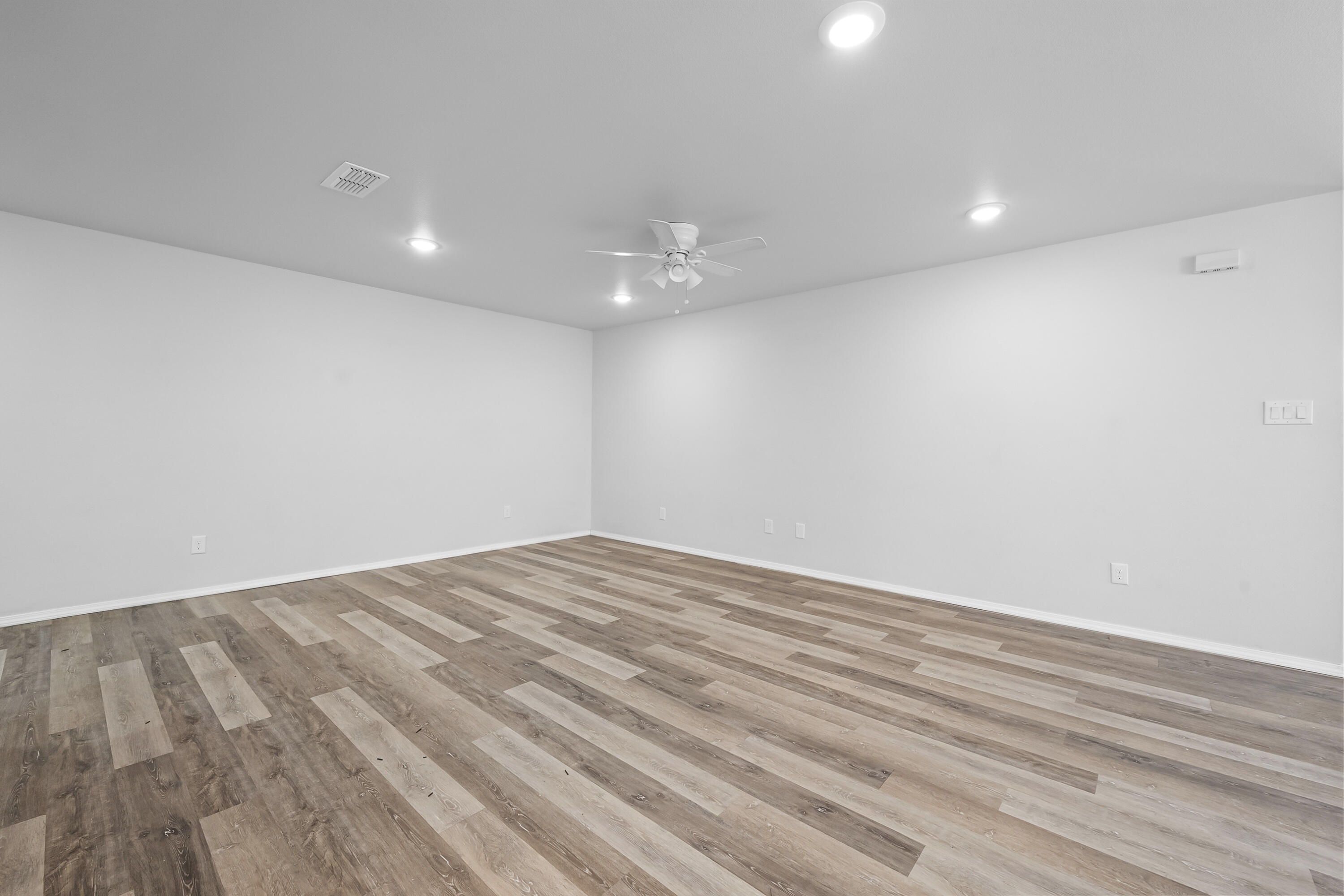 5609 Jarvis Street, Unit B Lubbock, TX 79416 - Photo 6 of 24 a view of empty room with wooden floor