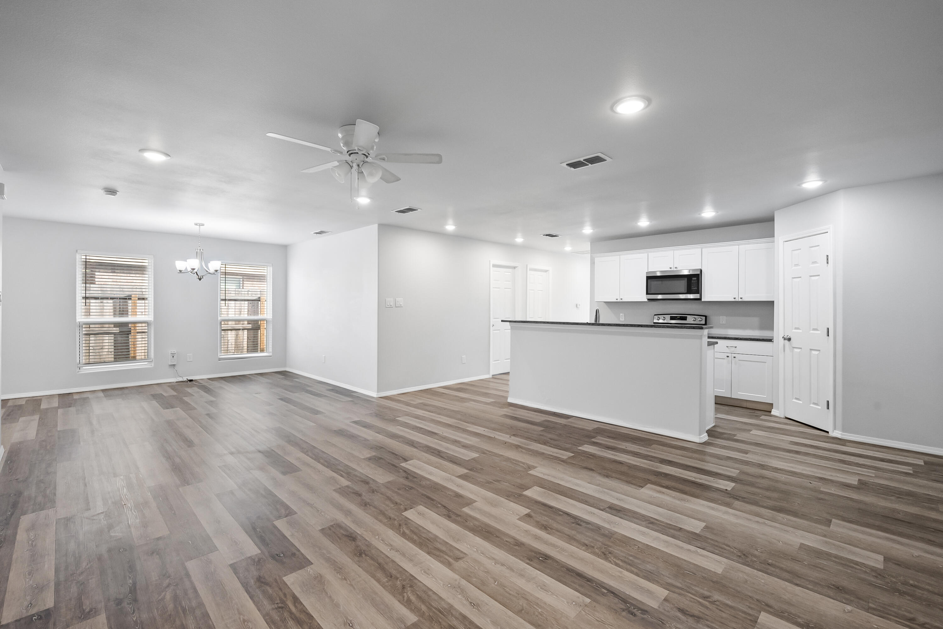 5609 Jarvis Street, Unit B Lubbock, TX 79416 - Photo 8 of 24 a view of kitchen with wooden floor and window