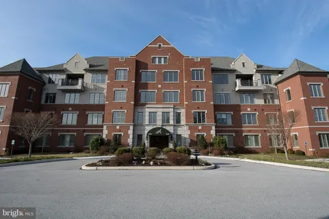 a front view of a building with street view
