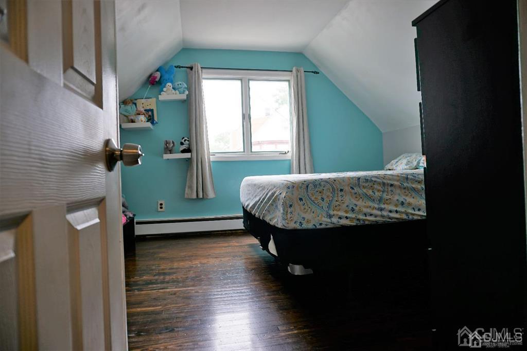 559 Johnstone Street Perth Amboy, NJ 08861 - Photo 16 of 24 a living room with furniture and a window