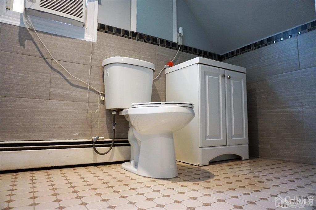 559 Johnstone Street Perth Amboy, NJ 08861 - Photo 18 of 24 a bathroom with a sink
