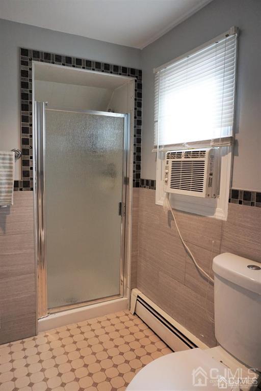 559 Johnstone Street Perth Amboy, NJ 08861 - Photo 19 of 24 a bathroom with a sink toilet and shower