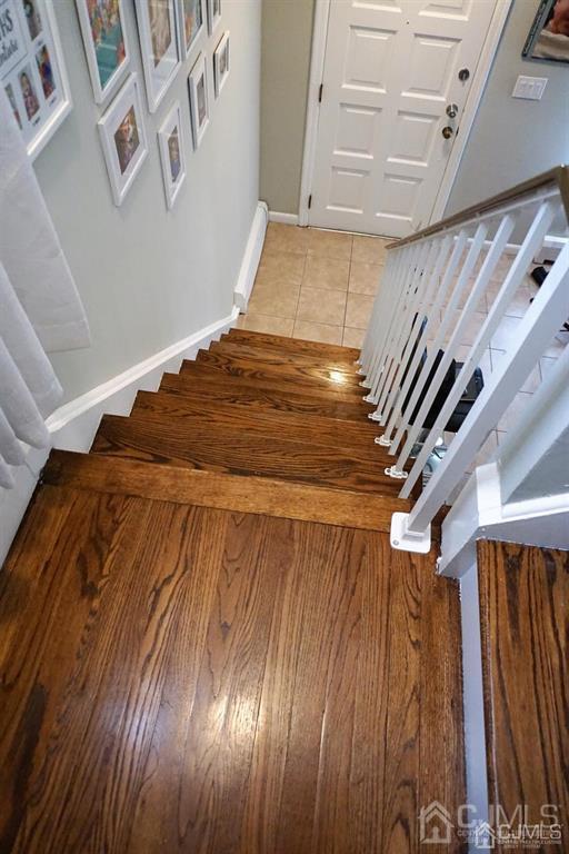 559 Johnstone Street Perth Amboy, NJ 08861 - Photo 21 of 24 a bedroom with a bed and a mirror