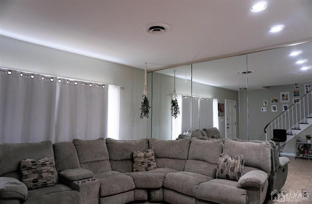 559 Johnstone Street Perth Amboy, NJ 08861 - Photo 7 of 24 a living room with furniture and a couch