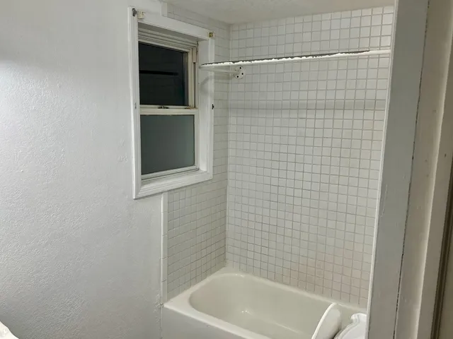 a view of a bathroom with a sink and mirror