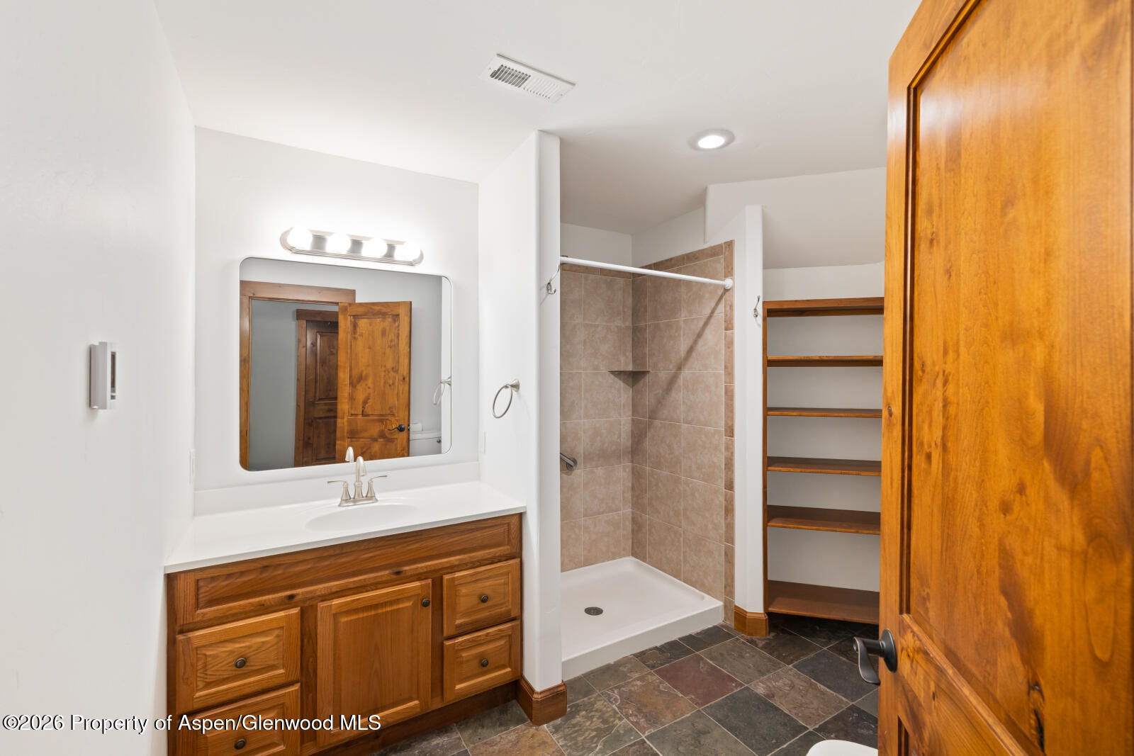 316 Faas Ranch Road New Castle, CO 81647 - Photo 37 of 50 a bathroom with a sink a mirror and a shower