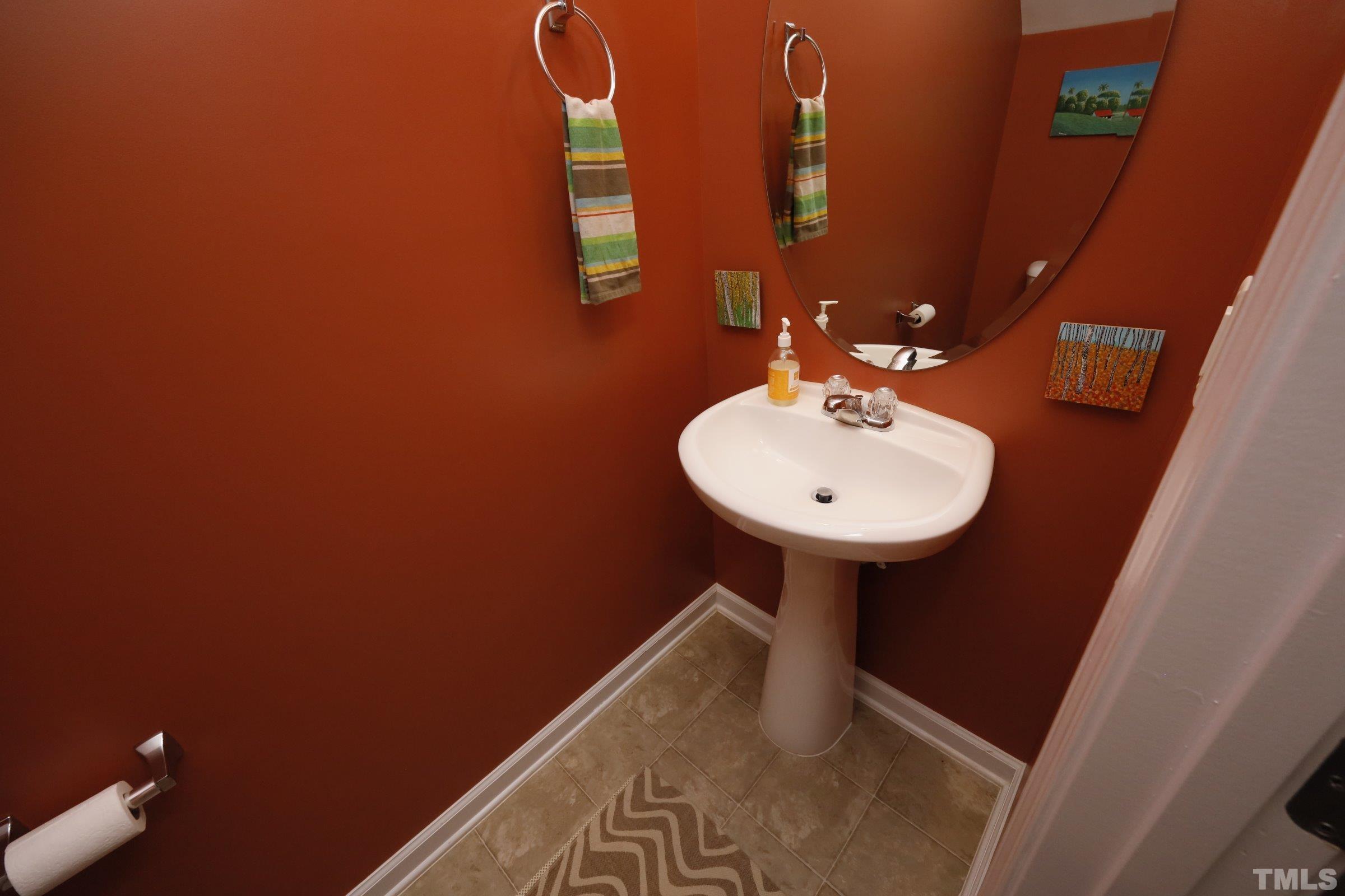 304 Red Elm Drive Durham, NC 27713 - Photo 13 of 27 a bathroom with a sink and a mirror
