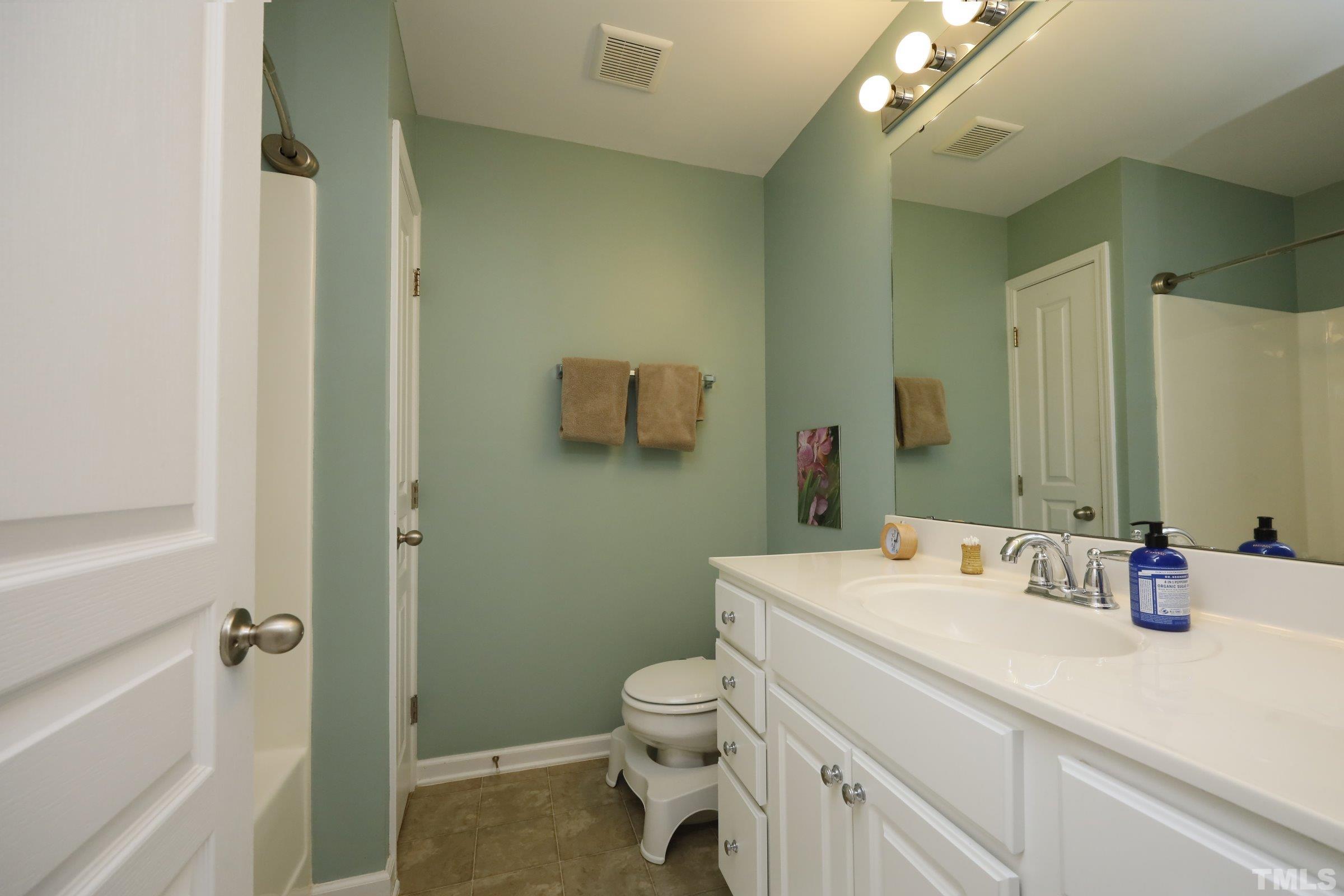 304 Red Elm Drive Durham, NC 27713 - Photo 18 of 27 a bathroom with a sink a toilet and shower