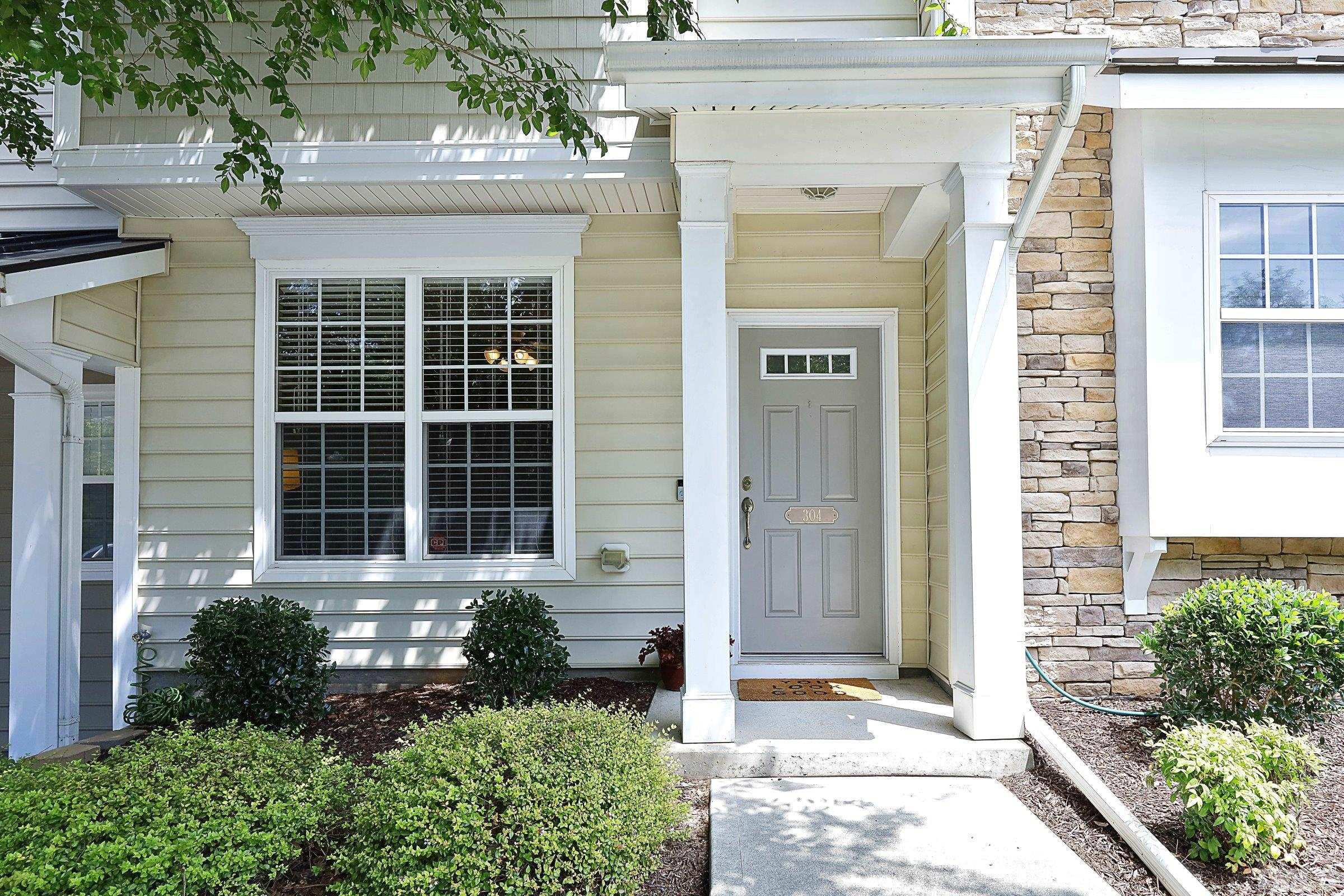 304 Red Elm Drive Durham, NC 27713 - Photo 2 of 27 a front view of a house with a yard
