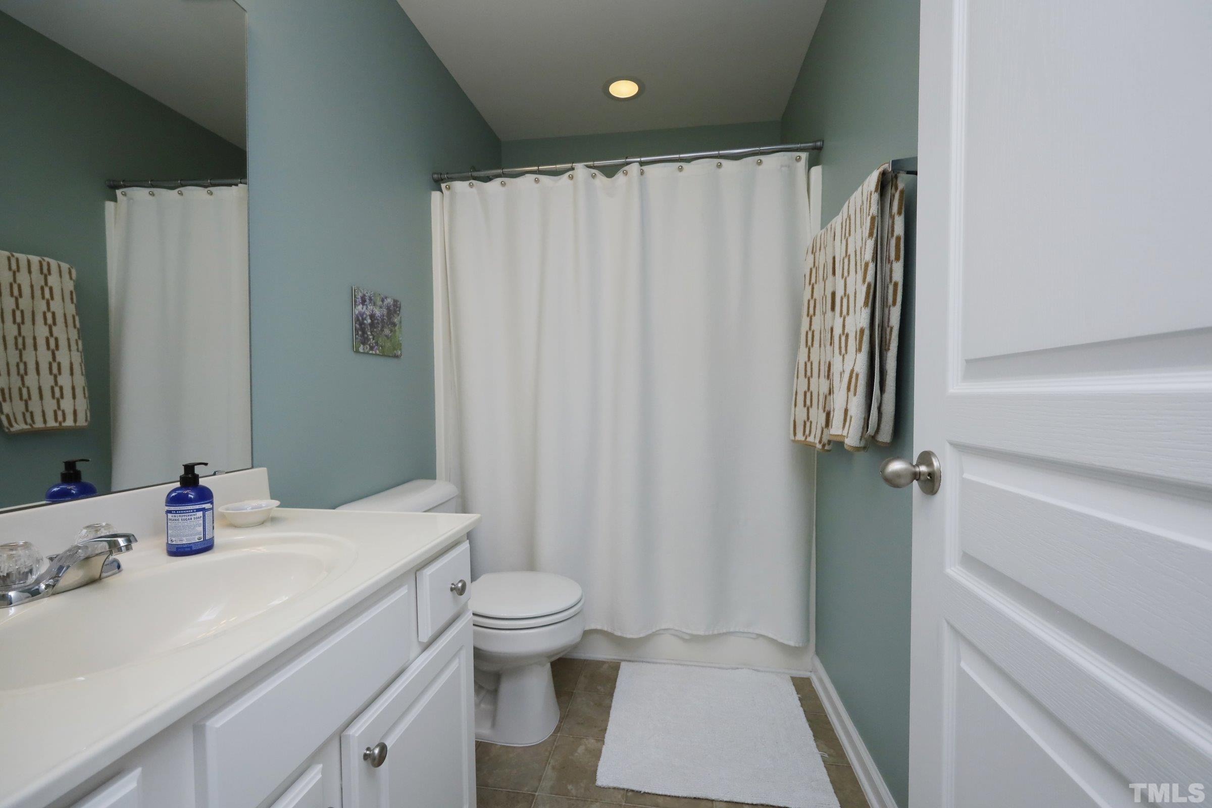 304 Red Elm Drive Durham, NC 27713 - Photo 21 of 27 a bathroom with a sink toilet and shower