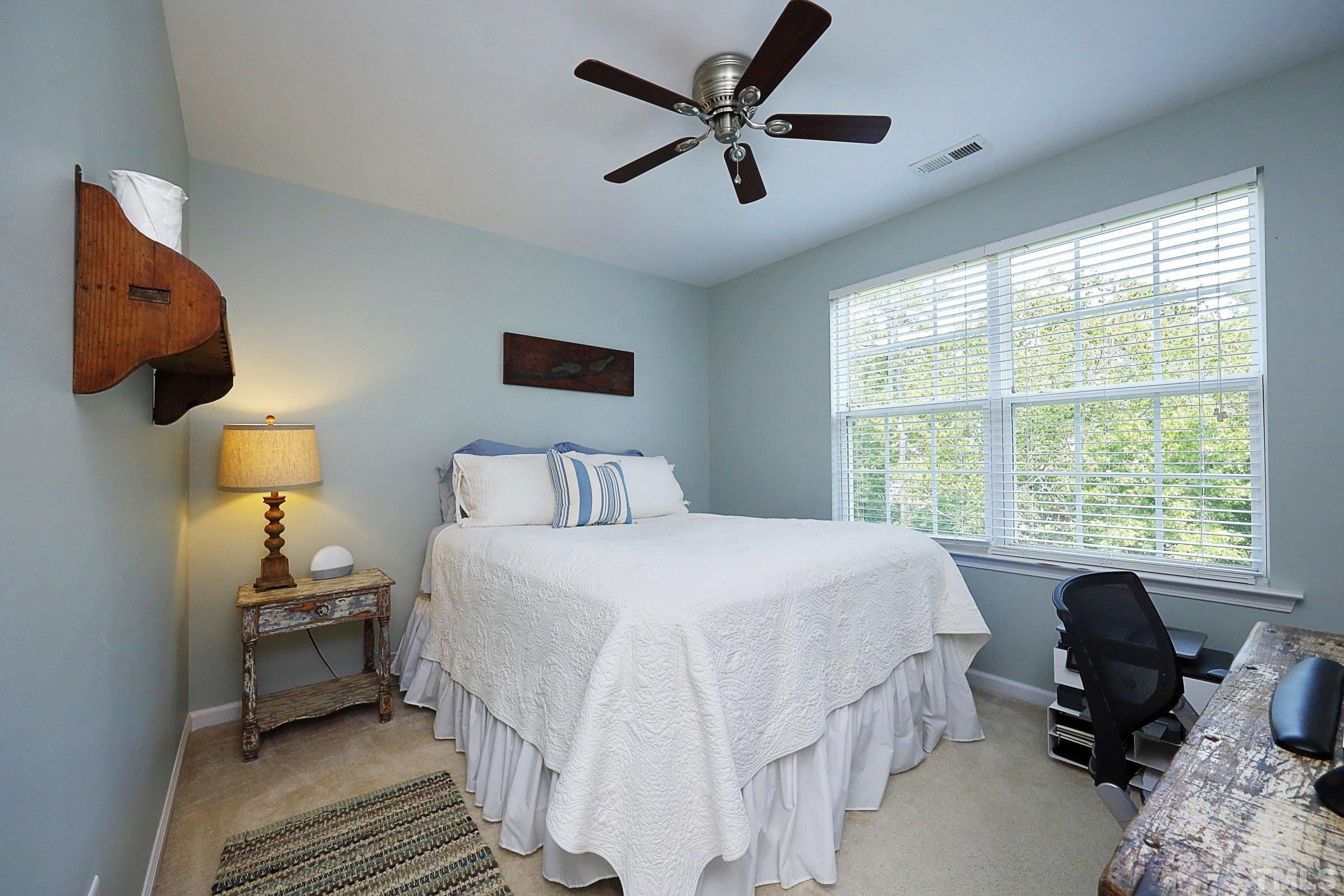 304 Red Elm Drive Durham, NC 27713 - Photo 22 of 27 a bedroom with a bed and a window