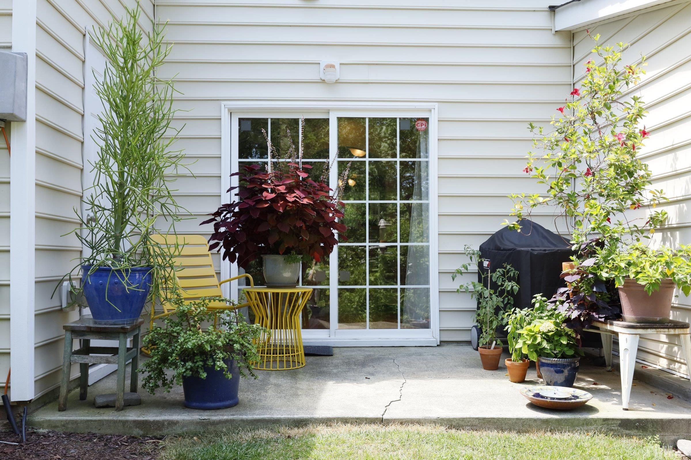304 Red Elm Drive Durham, NC 27713 - Photo 23 of 27 a front view of a house with a garden and plants