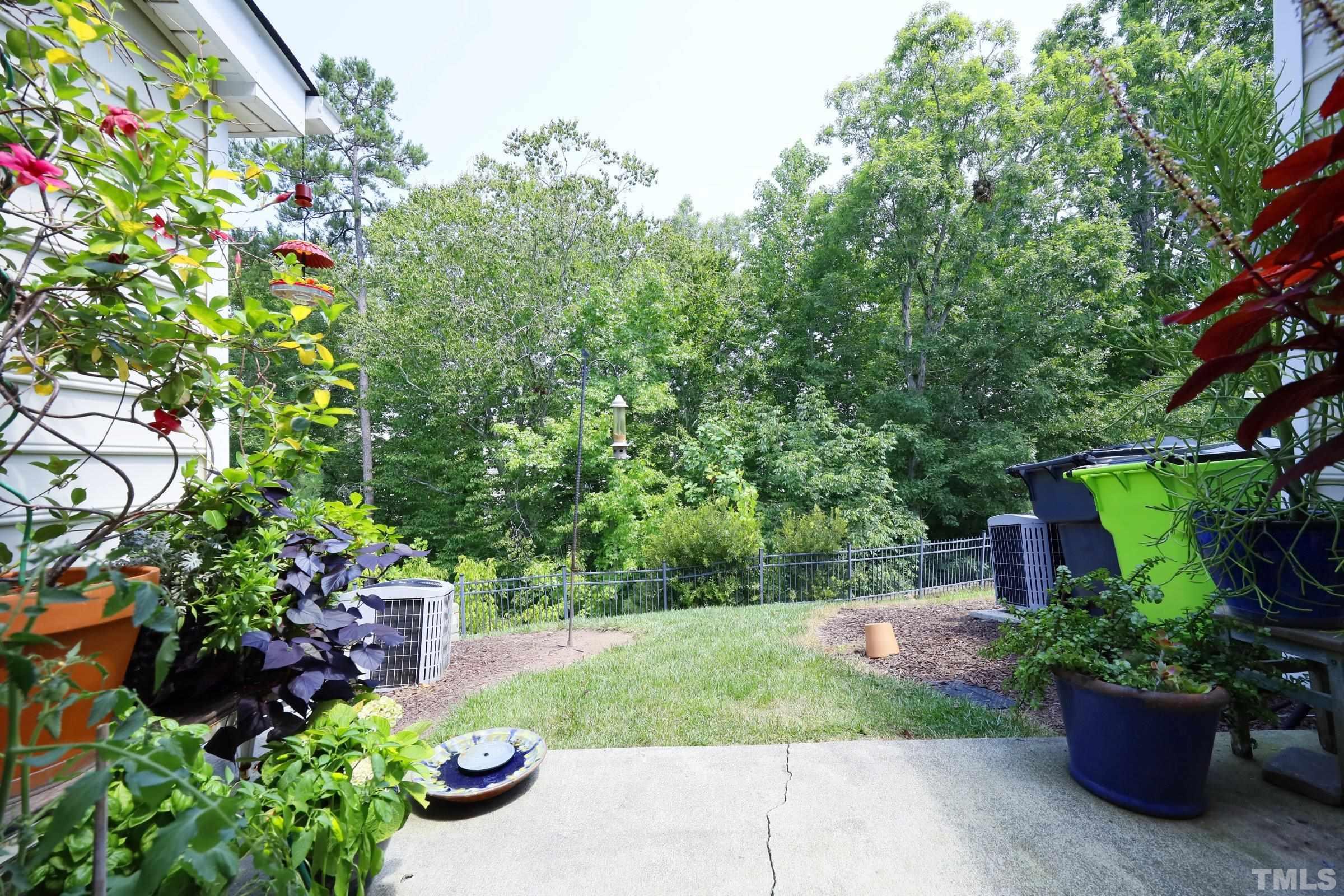 304 Red Elm Drive Durham, NC 27713 - Photo 25 of 27 a view of a garden with potted plants